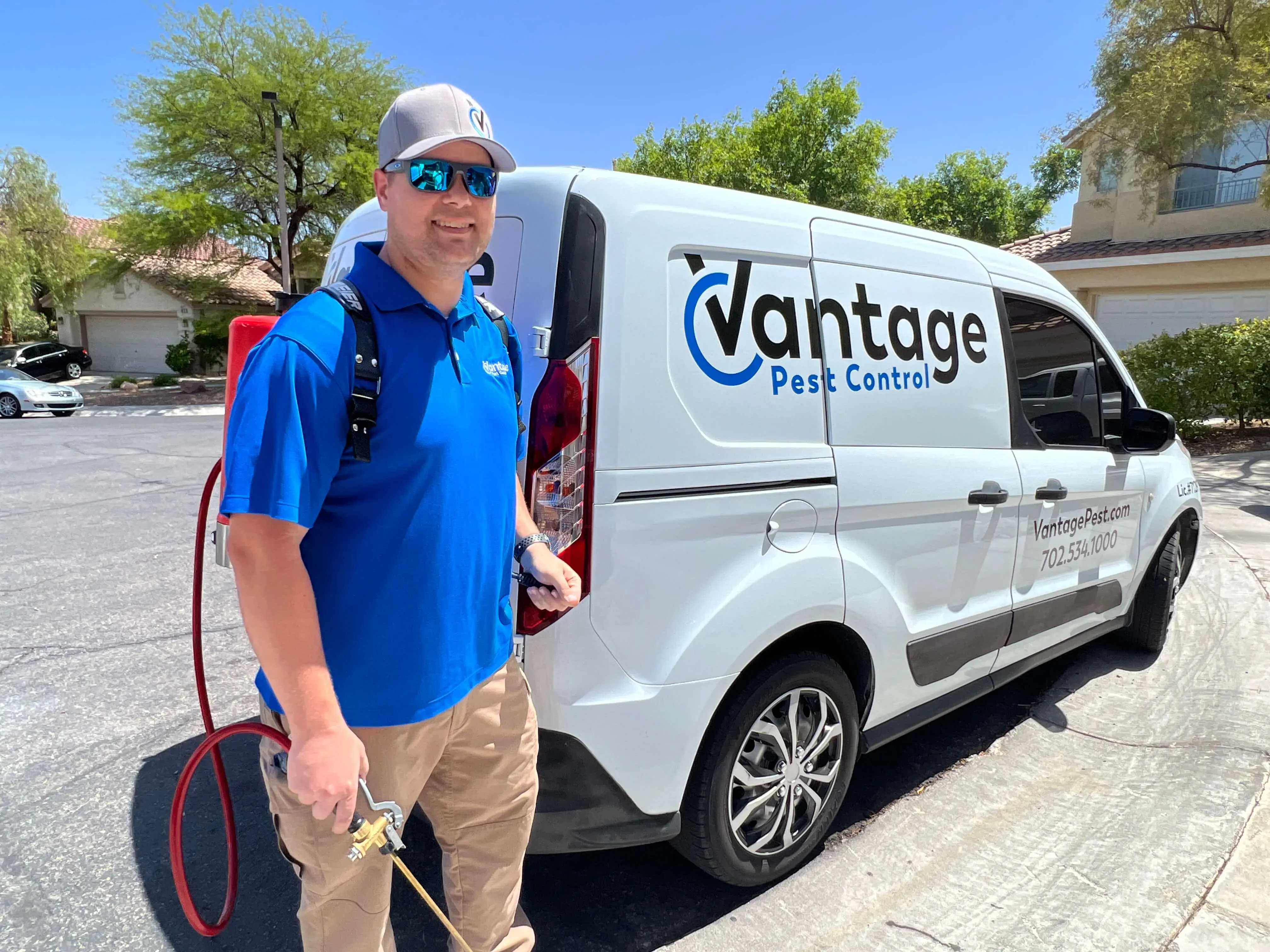 Vantage Pest Control technician performing a residential pest control treatment.